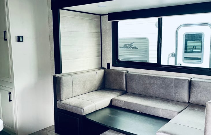 The U-Shape Dinette can be turned into a bed. 1 slide to expand the space and a large window for viewing pleasure.