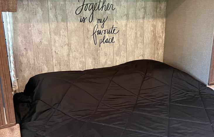 Queen sized RV bed with a comfortable 3 inch topper.
