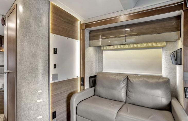 Loveseat with seatbelts and can be converted to a sleeper.