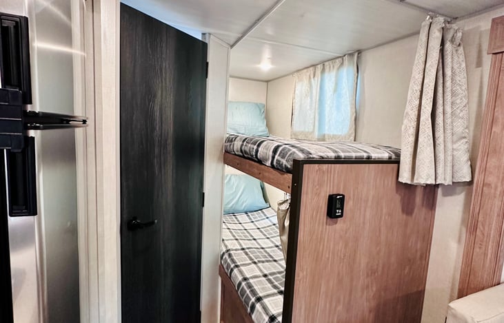Double bunk with cozy comfy new pillows and soft blankets for the littles