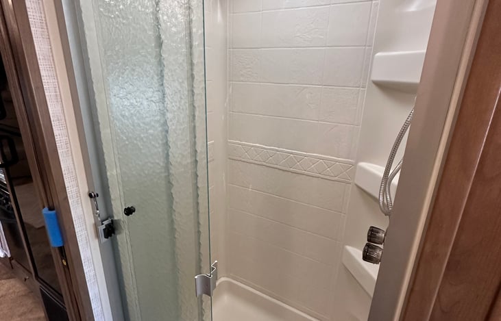 Shower. This area has a sliding door for privacy.