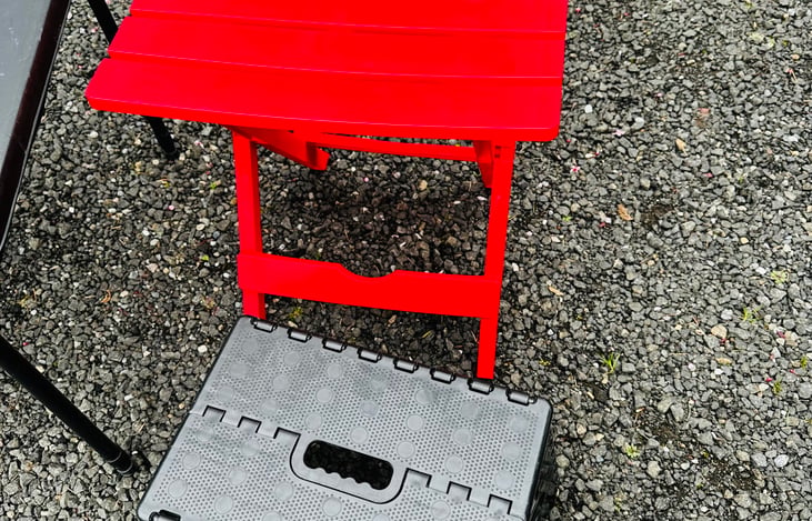Small folding outdoor table and folding step stool