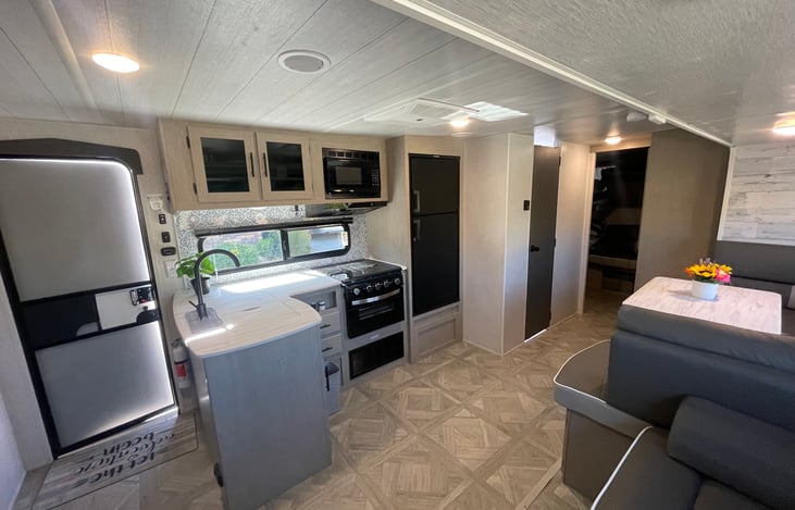 Spacious kitchen with a 3 burner gas stove and upgraded fridge!