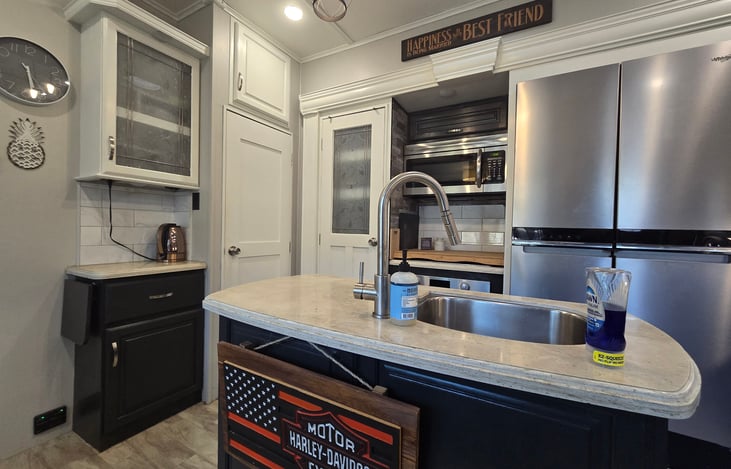 Kitchen with island and cupboards