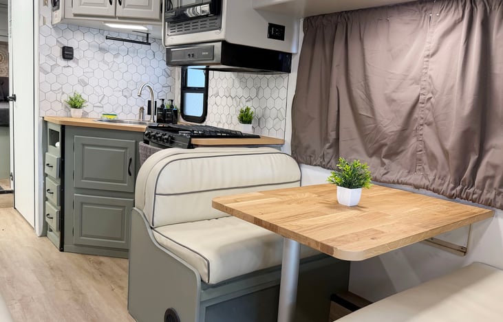 Fully equipped RV kitchen & dining area – everything you need for your camping getaway