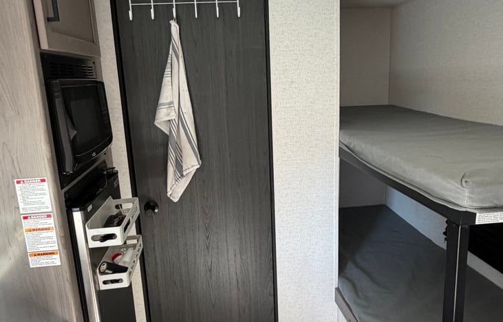 Hooks on both sides of the door for shower towls and kitchen towels
