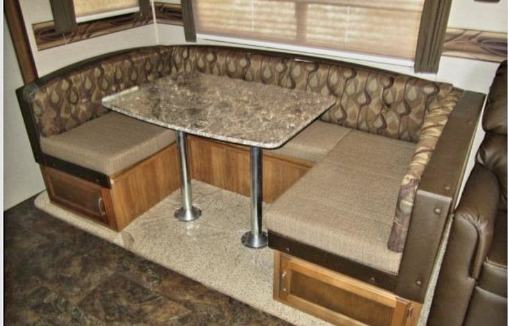 Table lowers down and extra cushions make this a comfy spot for 2 people!!!
