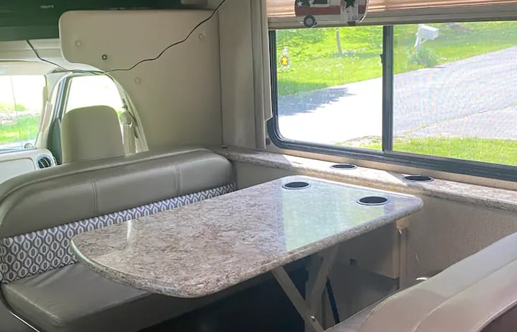 Table easily folds down for additional sleeping space.