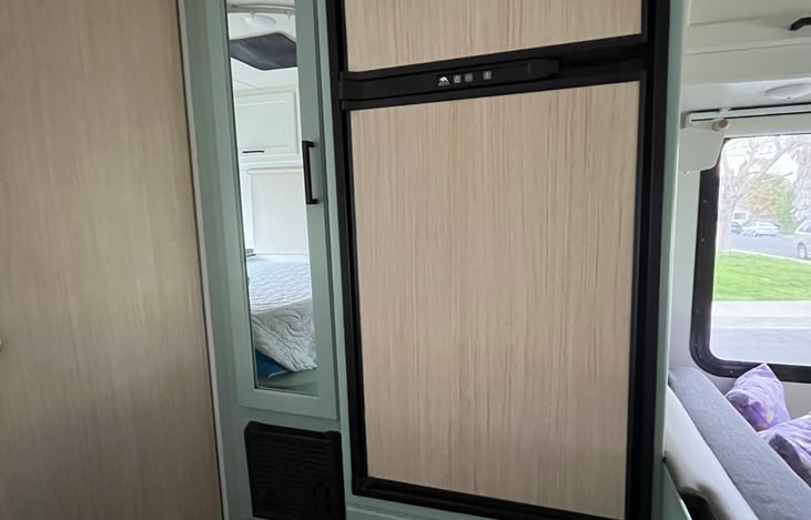 Refrigerator and freezer keep all your items fresh. Small wardrobe provides an area to hang your clothes.