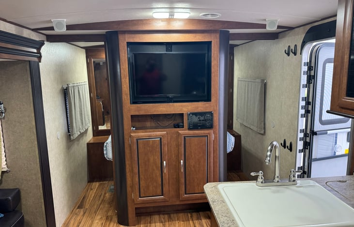 Living Room Tv that will spin around into the Master Bedroom