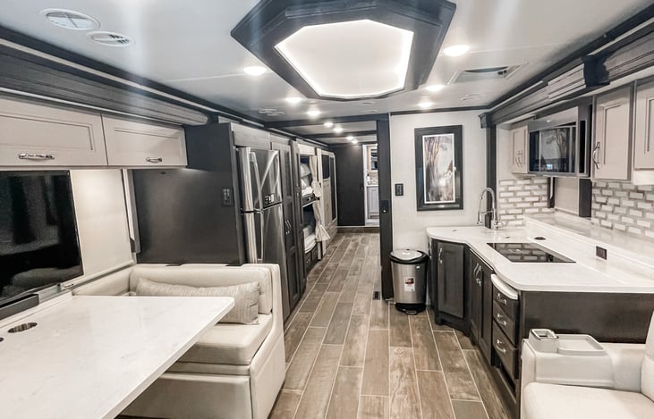 Contemporary luxury meets the road with our upscale black and white interior - setting new standards in RV desig
