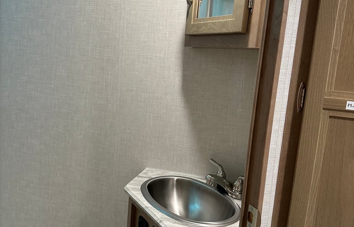 Stainless sink along with storage in cabinet