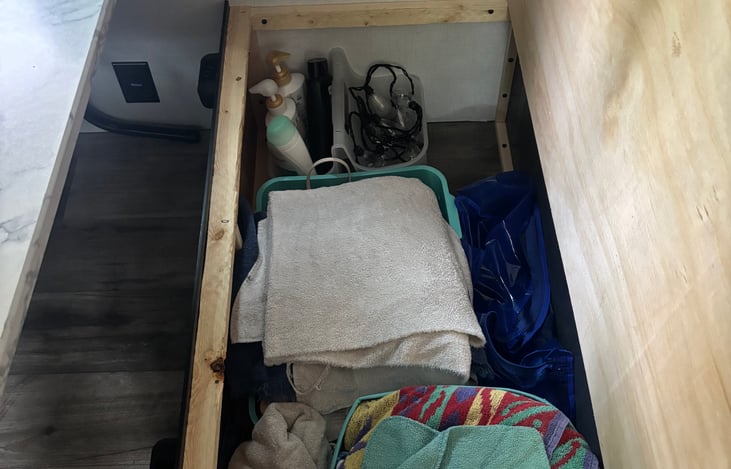 towels for bath and beach, shower essentials, first aid kit and lamps, head lamps batteries etc.