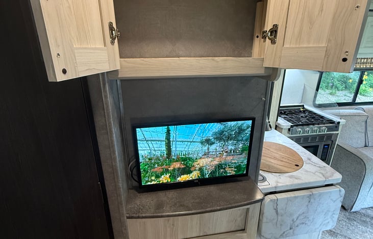 Small storage above and below this TV