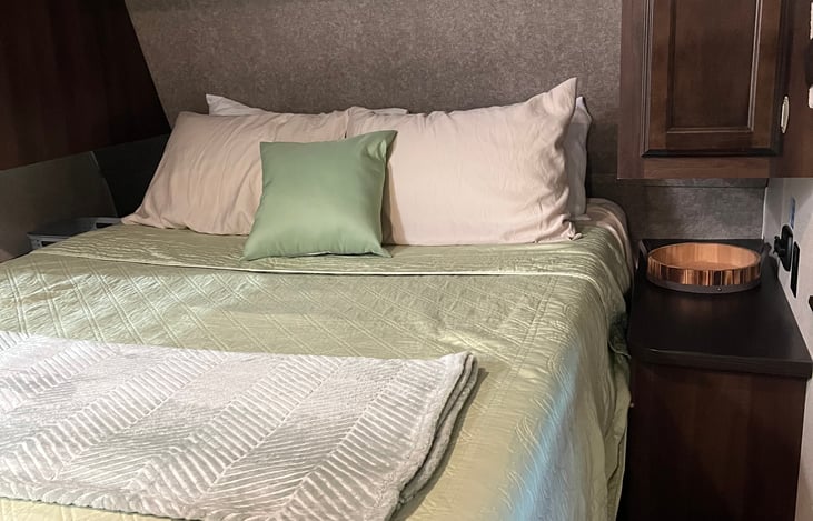 queen size bed; pillows and bedding included