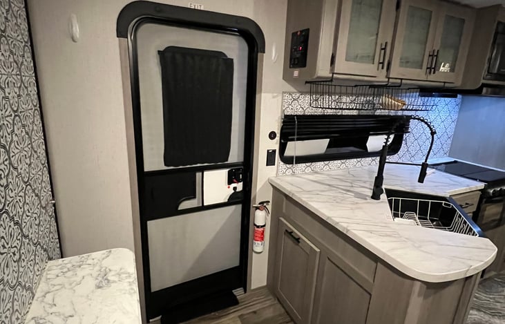 Privacy curtain on door, or remove the glare and reduce heat.