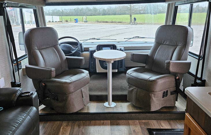 Captains Chairs swivel around for conversation or a small table to eat or play cards.