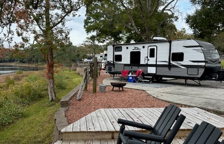 Come enjoy our camper and relax. This photo was taken at Twin Lakes DeFuniak Springs. Yes, we deliver to this location.