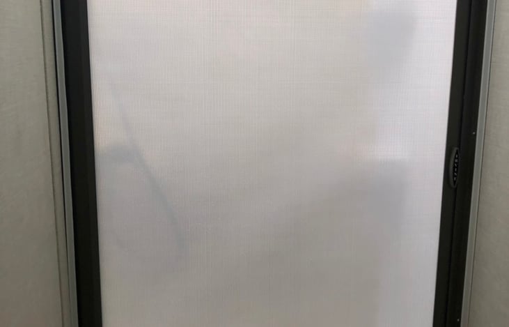 Rolling shower curtain/door when closed.