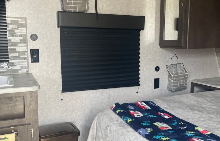 Queen bed with two night stand areas, small tv over window. Bring a hotspot to run streaming services. Rent from the local library (suggest 3 weeks ahead request).