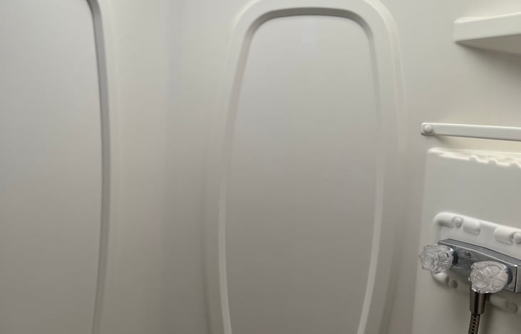 Shower is separate from the toilet/sink area to allow more people to use the bathroom at one time.