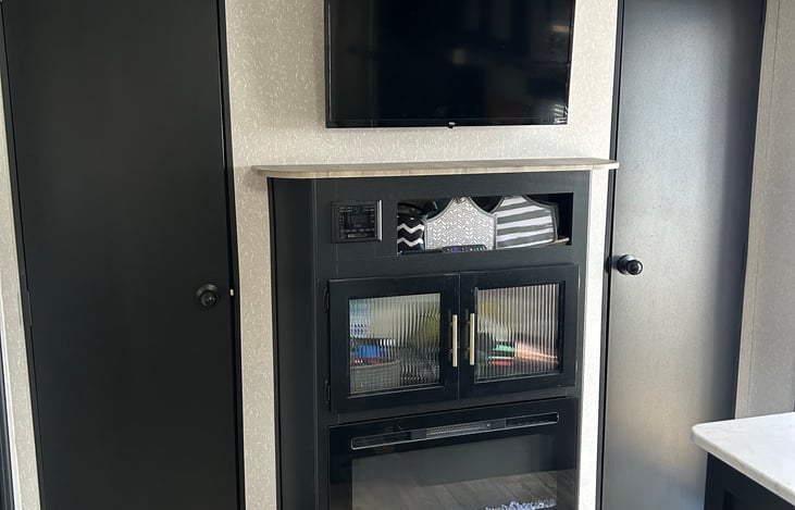 Double entrances to the main bedroom and a working propane fireplace.