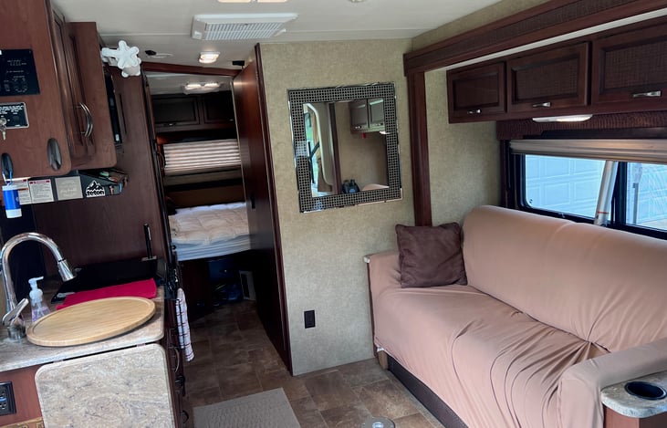 Couch folds down into small double bed.