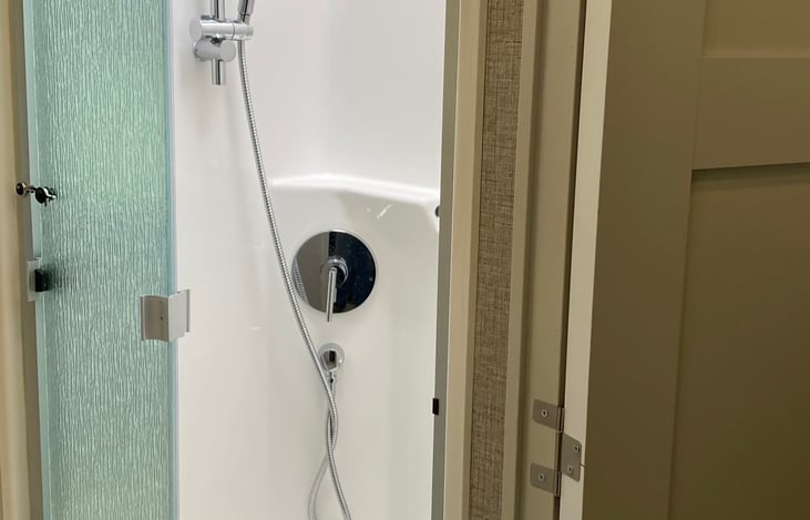 Mid coach shower in second bathroom.