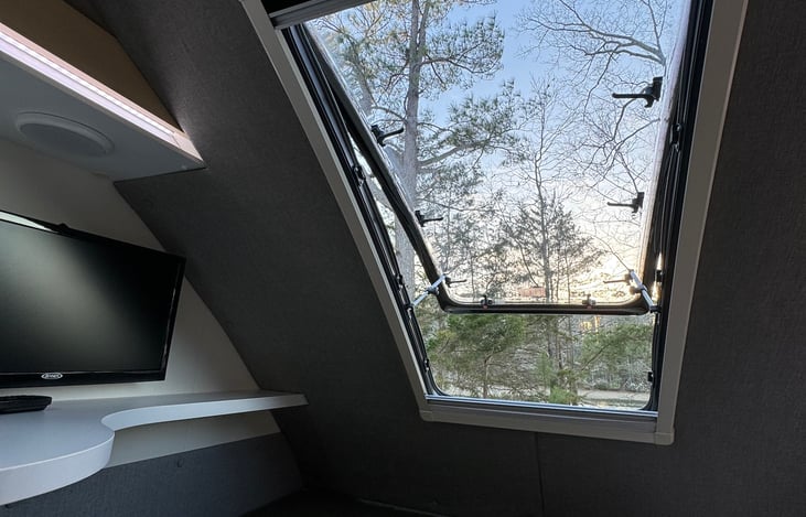 Stargazer window above the bed. 

22” TV with remote & over-the-air HDTV antenna and USBC to HDMI adapter to connect your phone to the TV.