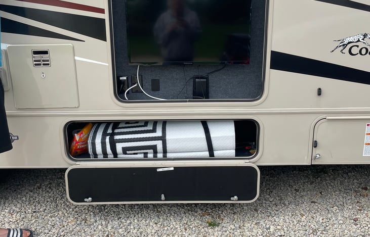 Outdoor TV and extra large outdoor area rug.