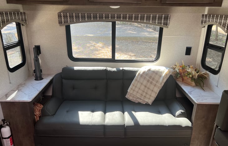 Couch folds out to bed with storage underneath.