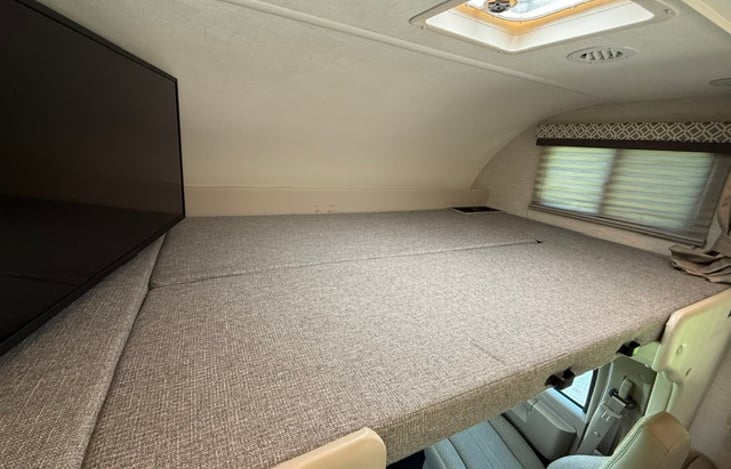 Large loft area for the kids to fight over! Drink holders and hidden storage on side.