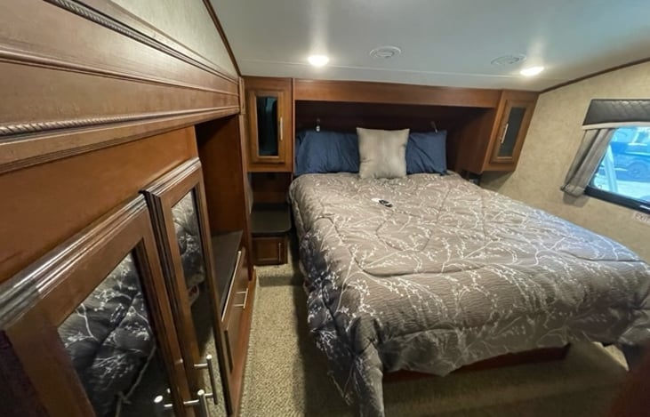 Queen size bed with ample storage.