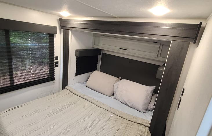 Upgraded sleep! Two pillows per person. The unit is equipped with a comforter, flat sheet, fitted sheet, and extra blankets. Queen bed is 60 X 75, medium support, cooling memory foam.