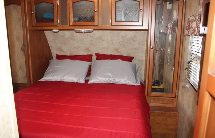 Queen bed with memory foam second mattress. Two hanging closets as well a hall clothes closet with shelves. Bed and pillows have protective covers.