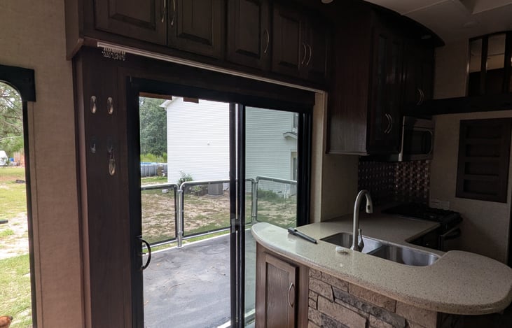 Sliding glass doors out to the porch area.