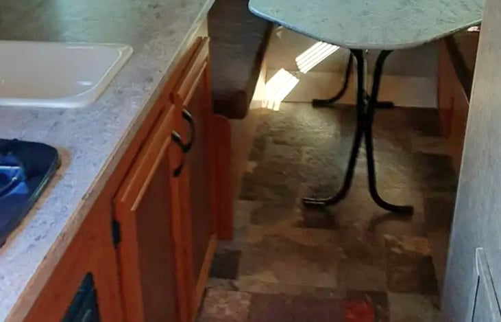 Rear dining table makes a queen sized bed.