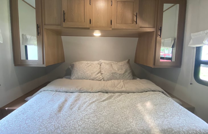QUEEN BED WITH LOTS OF STORAGE. 120V/USB OUTLET ON EACH SIDE OF BED.