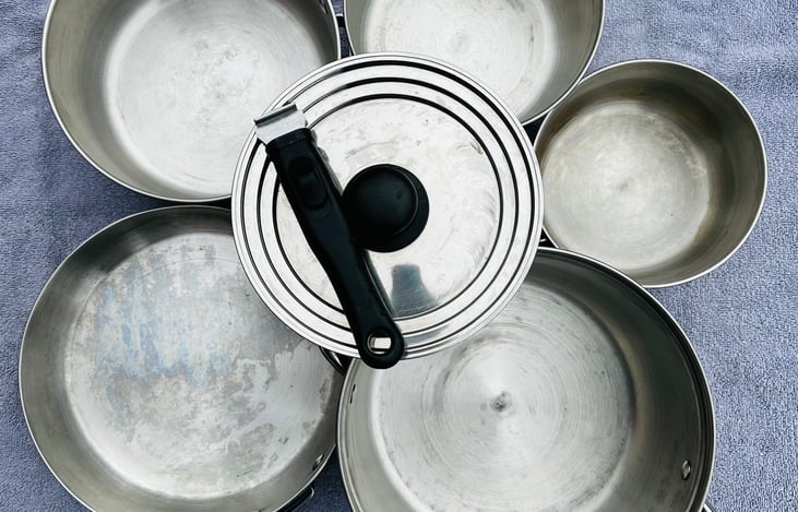 Nesting pit and pan set. Detachable handle works on all pots and pan. Also included but not pictured- spatula, tongs, and serving spoon.
