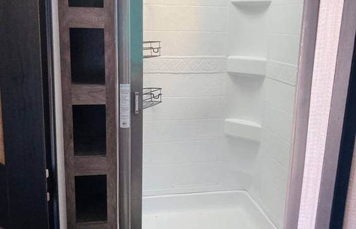 Big shower, plenty of bathroom leg room, lots of storage