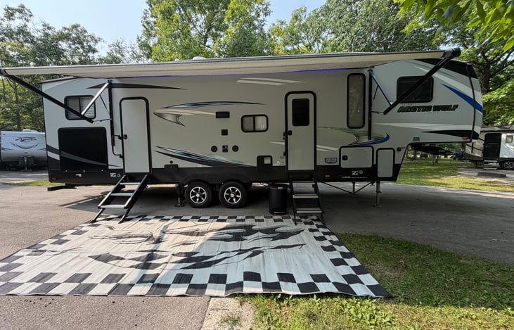 Full Awning, left black compartment is the outdoor kitchen. Two doors for access.