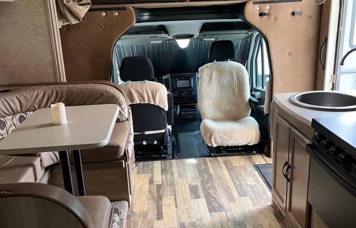 Driver and passenger chairs rotate to face forward or backward for extra seating when parked!