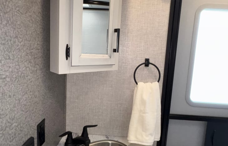 Bathroom sink and 2nd exterior door.