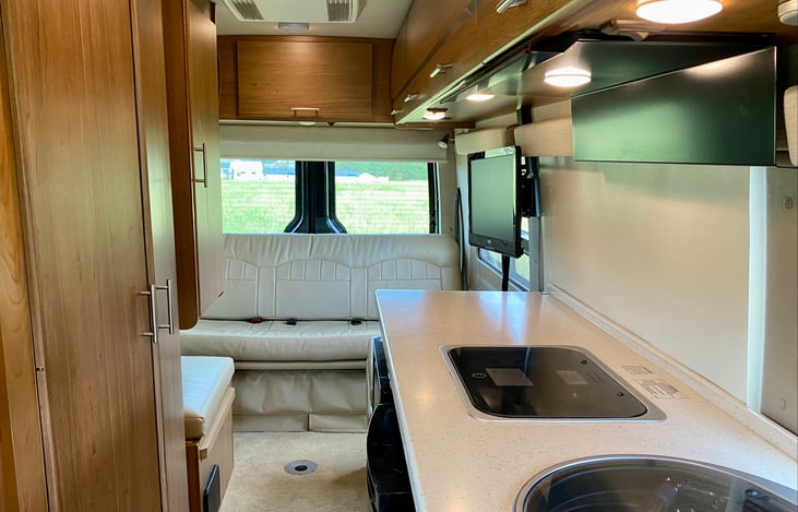 The convertible coach/bed has three seatbelts