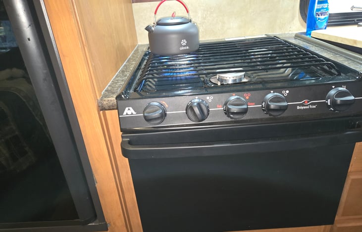 Three burner cook top and gas oven.