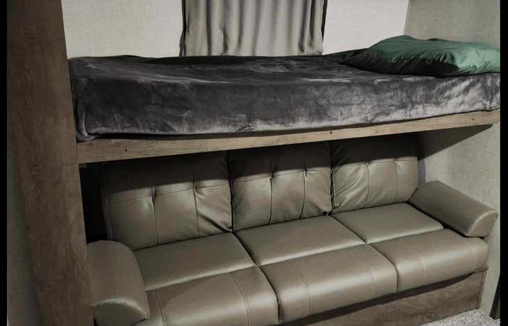 Twin bed on top and jackknife couch on bottom.