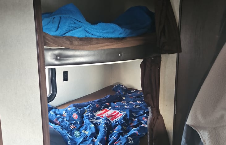 Bottom bunk is extra large twin and top is twin