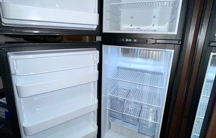 Large fridge/freezer combo with fridge organizers.