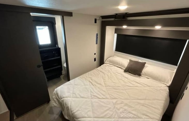 Queen bed with private bathroom and exterior access