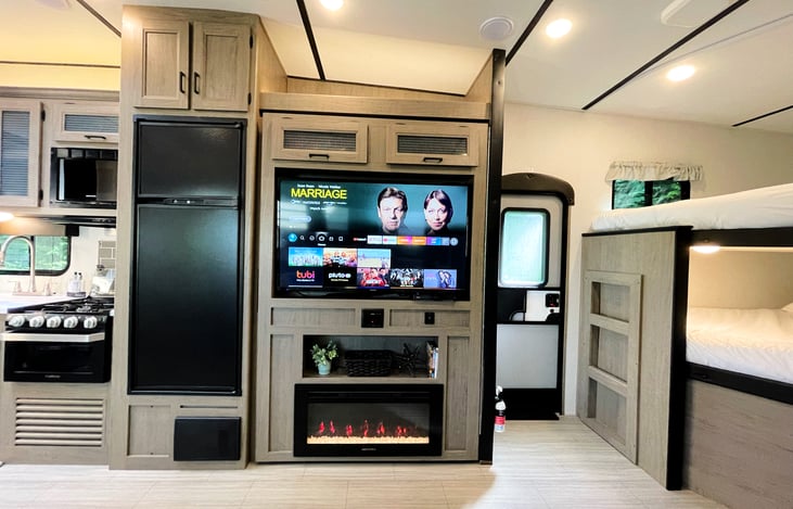 55" TV with DVD player and Amazon Fire Stick so you can watch your shows wherever there is WiFi. Cozy fireplace doubles as electric heater for the colder nights.